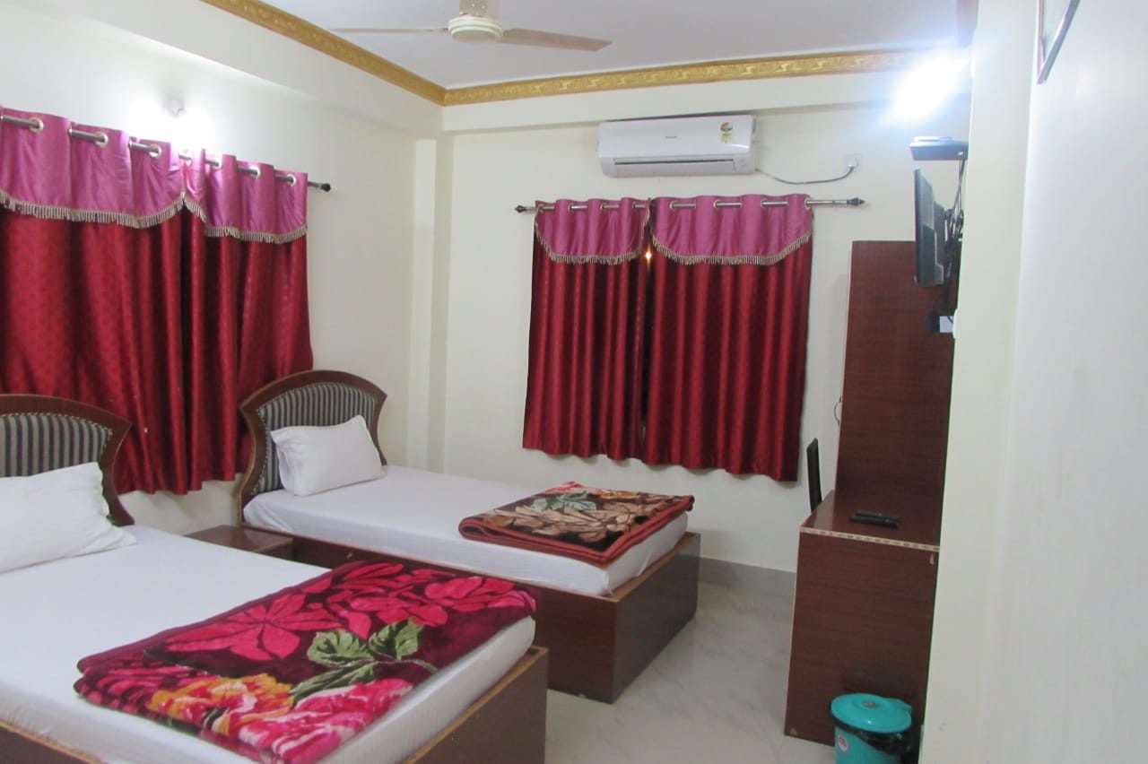 AC room with twin beds at Swagat Guest House